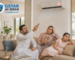 Frustrated family in Khalifa City Abu Dhabi facing AC not cooling issue inside modern villa, searching for AC repair near me